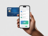 Indian hand holding a smartphone showing a UPI payment screen with a blurred RuPay credit card in the background, symbolizing digital payments and credit card integration.