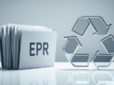 Documents symbolizing EPR registration on a clean white desk, with a subtle recycling symbol, representing compliance and sustainability.