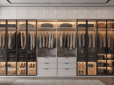 Luxurious modern walk-in dressing room wardrobe with organized clothes and accessories under elegant lighting against white background