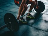 Creator lifting weights, representing a fitness influencer training for brand content